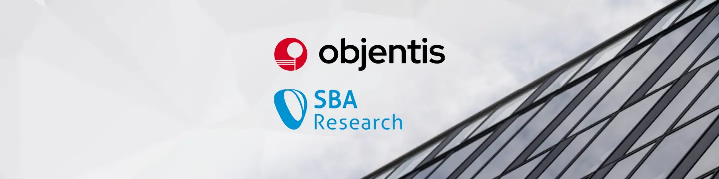 Objentis and SBA Research logos displayed in front of an office building, representing a partnership between the two organizations.